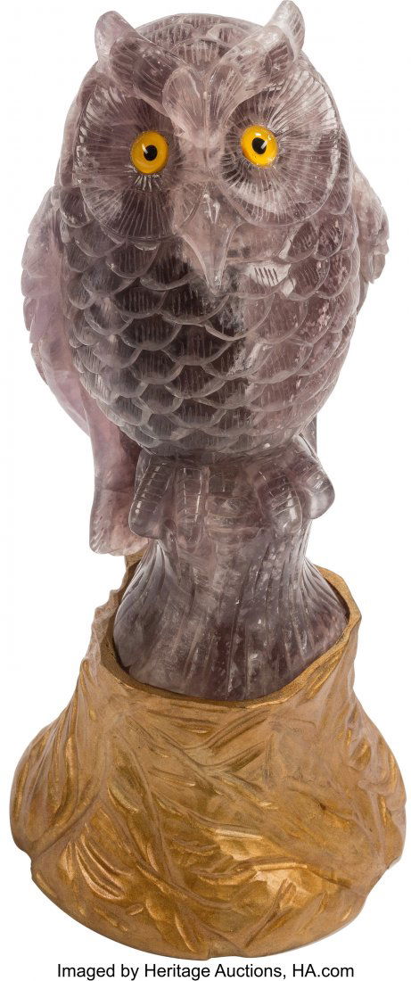 A Large Continental Carved Amethyst Figure of an: A Large Continental Carved Amethyst Figure of an Owl on Giltwood Base 16 x 7 x 7 inches (40.6 x 17.8 x 17.8 cm) The amethyst figure, depicting an owl perched upon a tree stump, supported by a carved g
