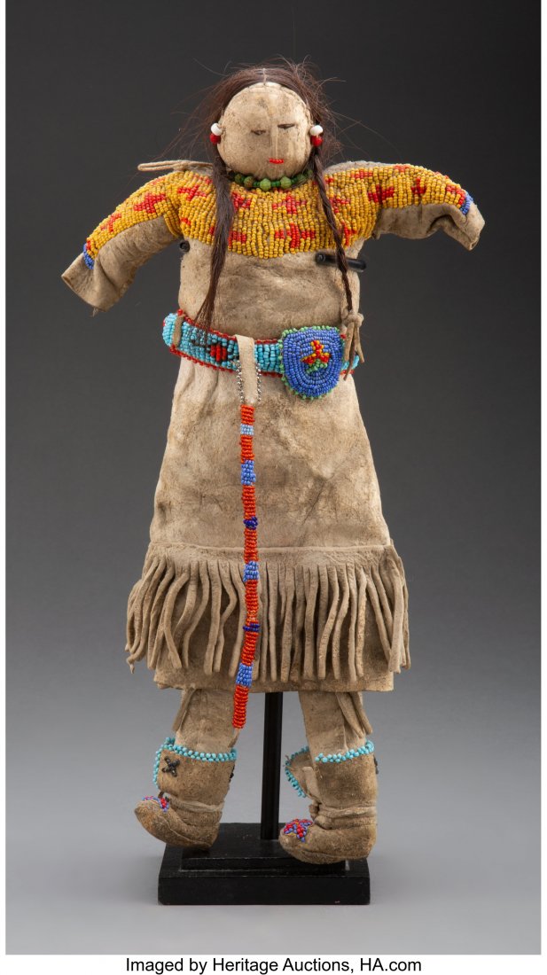 A Plains Beaded Hide Doll  c. 1920  hide, metal (1 of 3)