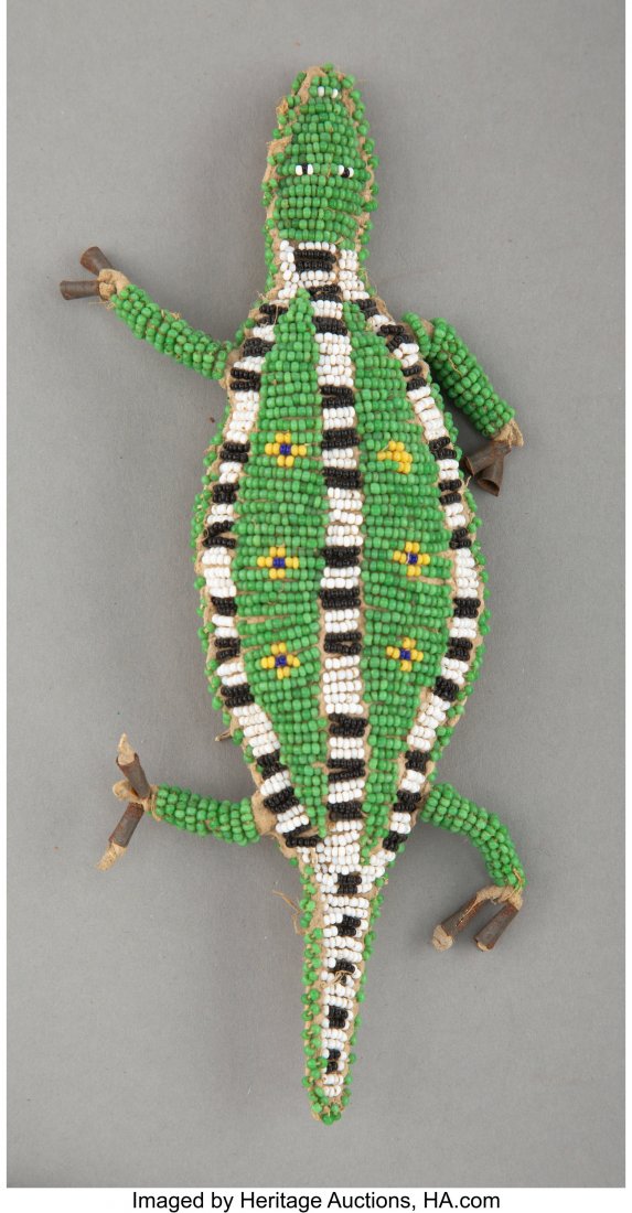 A Sioux Beaded Hide Fetish  c. 1890  hide, glass (1 of 2)