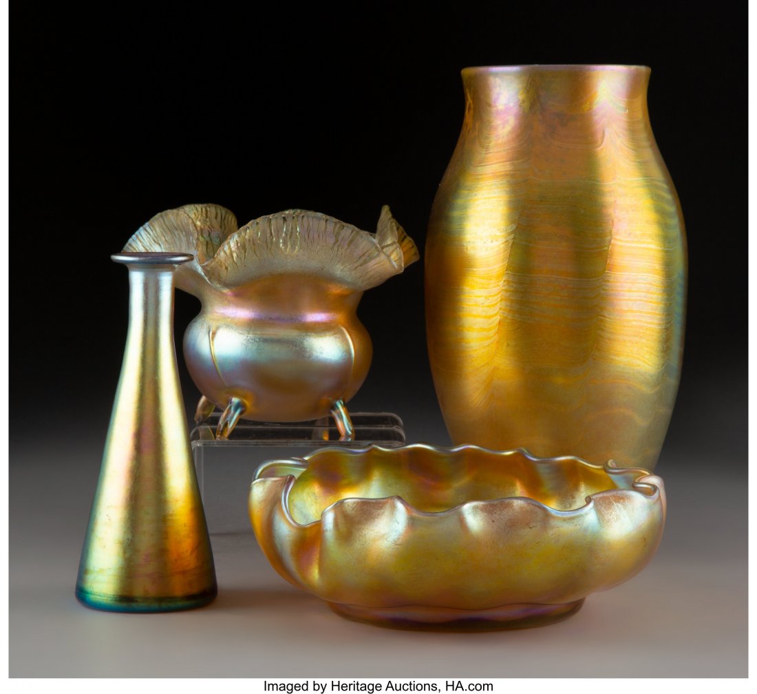 A Group of Four Tiffany Studios Favrile Glass Ar: A Group of Four Tiffany Studios Favrile Glass Articles, early 20th century Marks to tallest: L.C.T., H 2922 8-1/2 inches (21.6 cm) (tallest) The group comprising: 1 ruffle rim footed vase; 1 bowl; 1 f