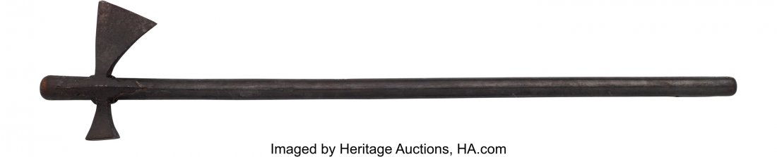European War Hammer/Axe. Approximately 32 1/4-: European War Hammer/Axe. Approximately 32 1/4-inches overall and 6 3/4-inches from tip of blade to face of hammer. Interesting overall form, iron composition with wooden handle. Fitted with a wooden s