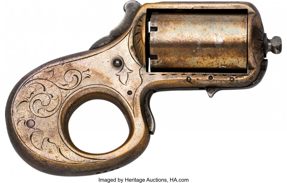 Reid Model My Friend Knuckle Duster Single Actio: Reid Model My Friend Knuckle Duster Single Action Revolver. Serial no. 5552, .22 caliber, 1 5/8-inch five shot cylinder. Silver-plated brass frame. Case-hardened hammer. Spur trigger. Scroll engraved 
