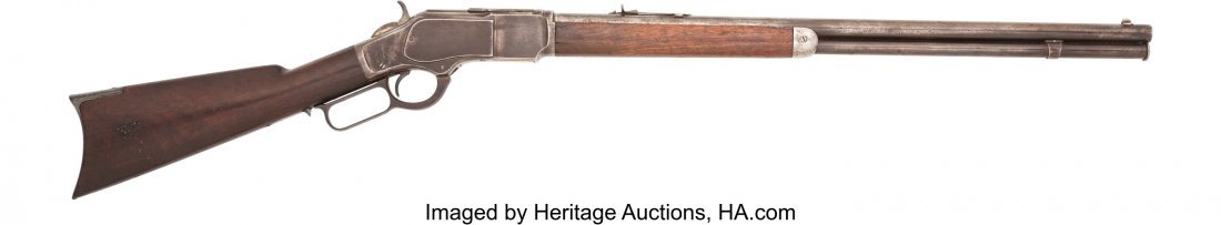 Antique Winchester Model 1873 Lever Action Rifle: Antique Winchester Model 1873 Lever Action Rifle. Serial no. 250465B, .22 short caliber, 24-inch round barrel with fixed front sight and rear elevation sight. Blued and case-hardened finish. Smooth wa