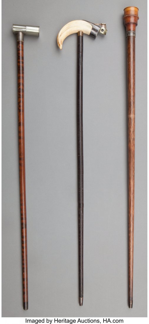 Three Figural Silver, Silver-Plate and Wood Cane: Three Figural Silver, Silver-Plate and Wood Canes: Boar Tusk with Cigar Cutter, Spirit Flask, Dice, late 19th/early 20th century Marks: C. ROBERTSON & CO; (British silver marks) 36 inches high (91