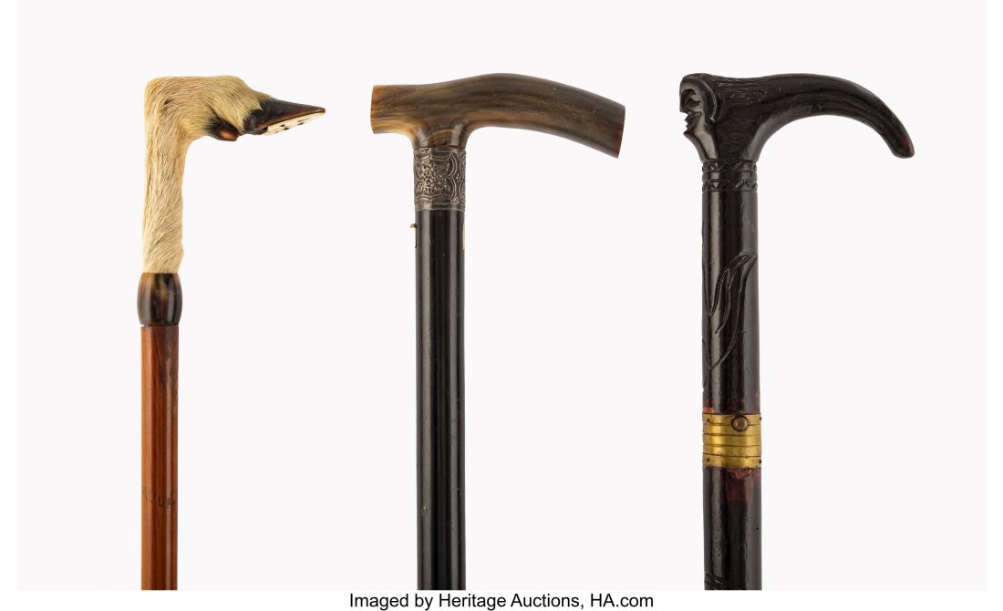 Three Wood Presentation Walking Sticks, circa 18: Three Wood Presentation Walking Sticks, circa 1890 Marks to one collar: (lion passant), (anchor), r, W.H.W 36-3/4 inches (93.3 cm) (longest, horn handle) The lot comprising: 1 ebonized wood example wi