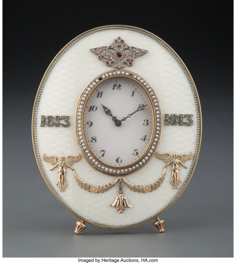 A 14K Gold, Mixed Metal, Diamond, Pearl, Guilloc: A 14K Gold, Mixed Metal, Diamond, Pearl, Guilloché Enamel, and Cabochon-Mounted Clock in the Manner of Fabergé with Fitted Box, late 20th century 4-3/4 inches (12.1 cm) PROPERTY FROM A N