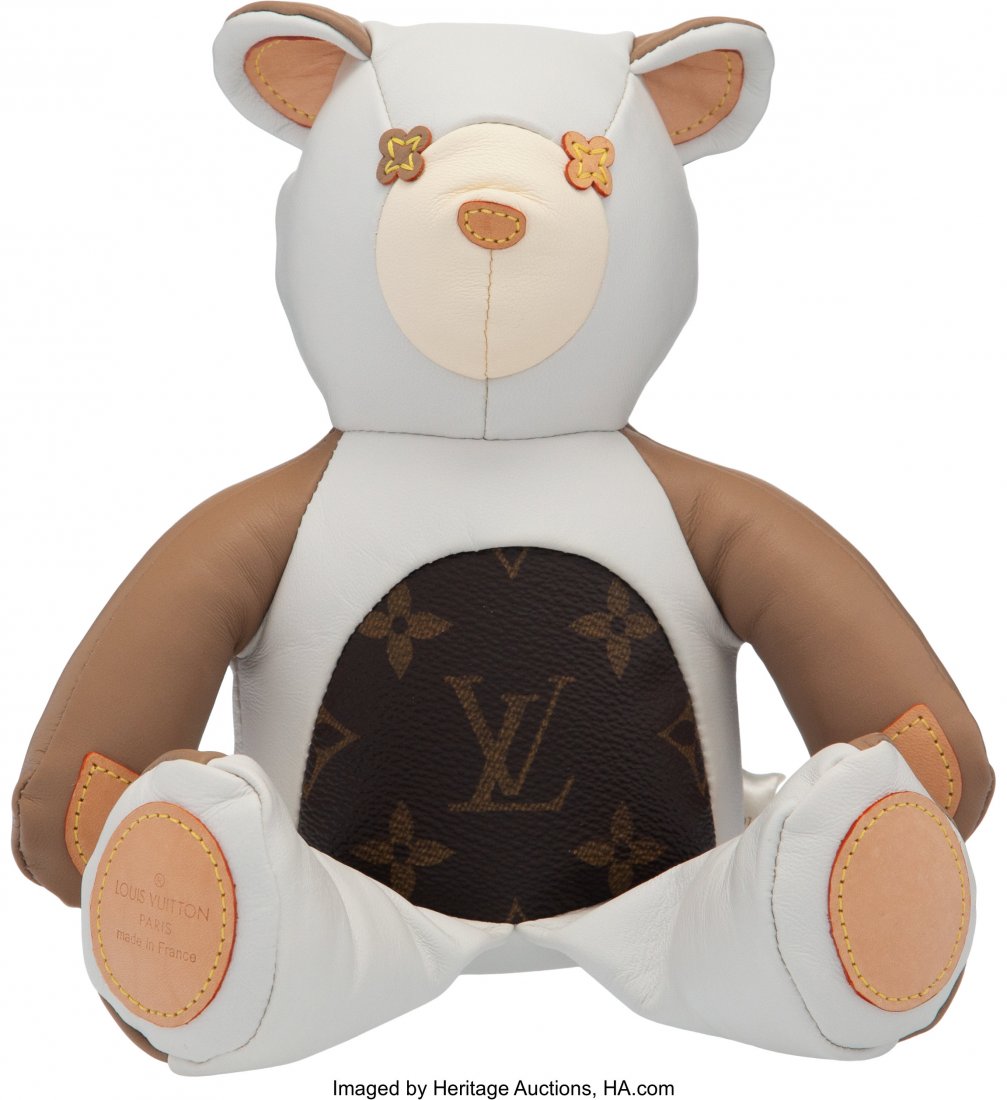 Louis Vuitton Leather & Monogram Coated Canvas T: Louis Vuitton Leather & Monogram Coated Canvas Teddy Bear Condition: 1 7" Width x 10" Height x 3" Depth This teddy bear is done in white and brown leather with classic monogram coated canvas and v