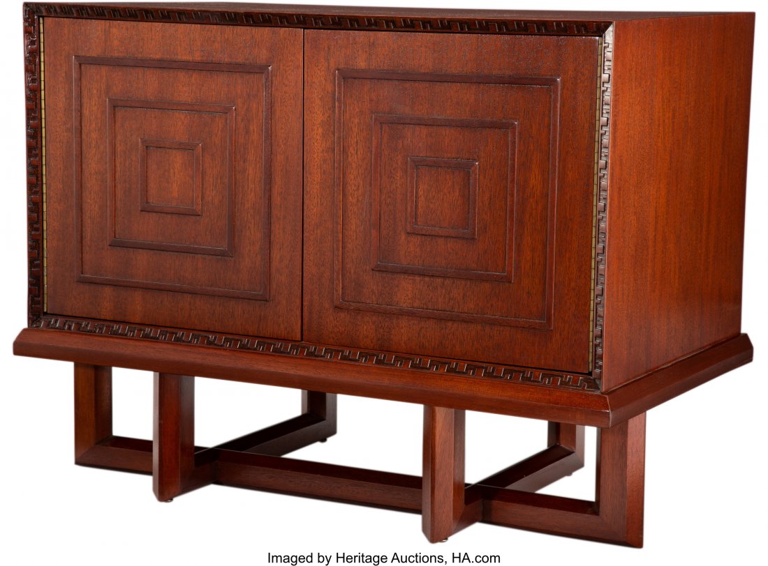 Frank Lloyd Wright (American, 1867-1959) Taliesi: Frank Lloyd Wright (American, 1867-1959) Taliesin Cabinet, circa 1950, Henredon Mahogany 26 x 33-1/2 x 20-3/4 inches (66.0 x 85.1 x 52.7 cm) Printed to verso (red Frank Lloyd Wright stamp), 2005 In a