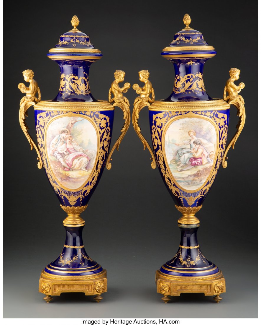 A Pair of French Sèvres-Style Gilt Bronze: A Pair of French Sèvres-Style Gilt Bronze Mounted Porcelain Covered Urns, 20th century Marks: (crossed L's in underglaze blue-M), S....., Geo. Rochet 30-1/2 x 12 x 9 inches (77.5 x 30.5 x 22.9