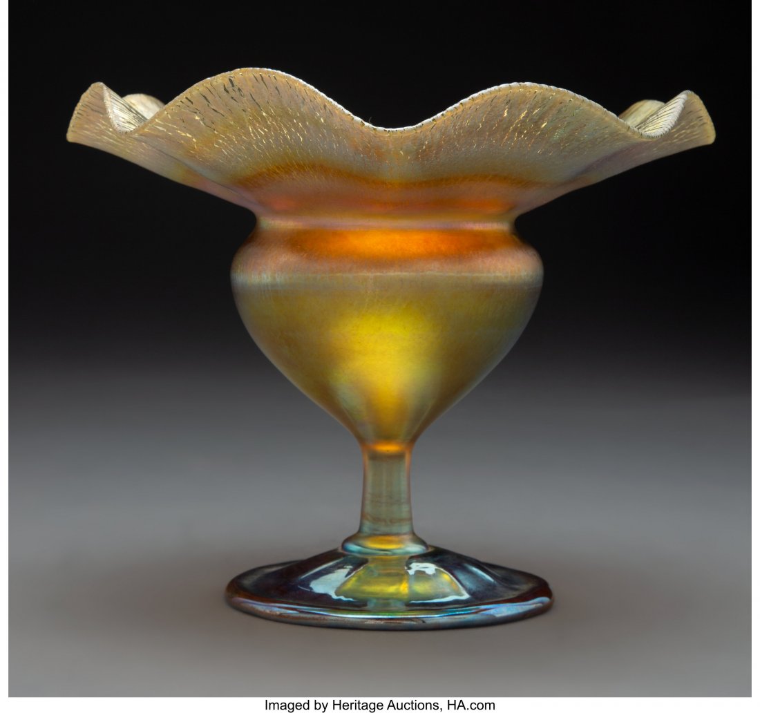 Tiffany Studios Favrile Glass Floriform Footed V: Tiffany Studios Favrile Glass Floriform Footed Vase, circa 1910 Marks: 9911 H, L.C. Tiffany-Favrile 6-3/4 inches (17.1 cm) HID03101062020 © 2020 Heritage Auctions | All Rights Reserved