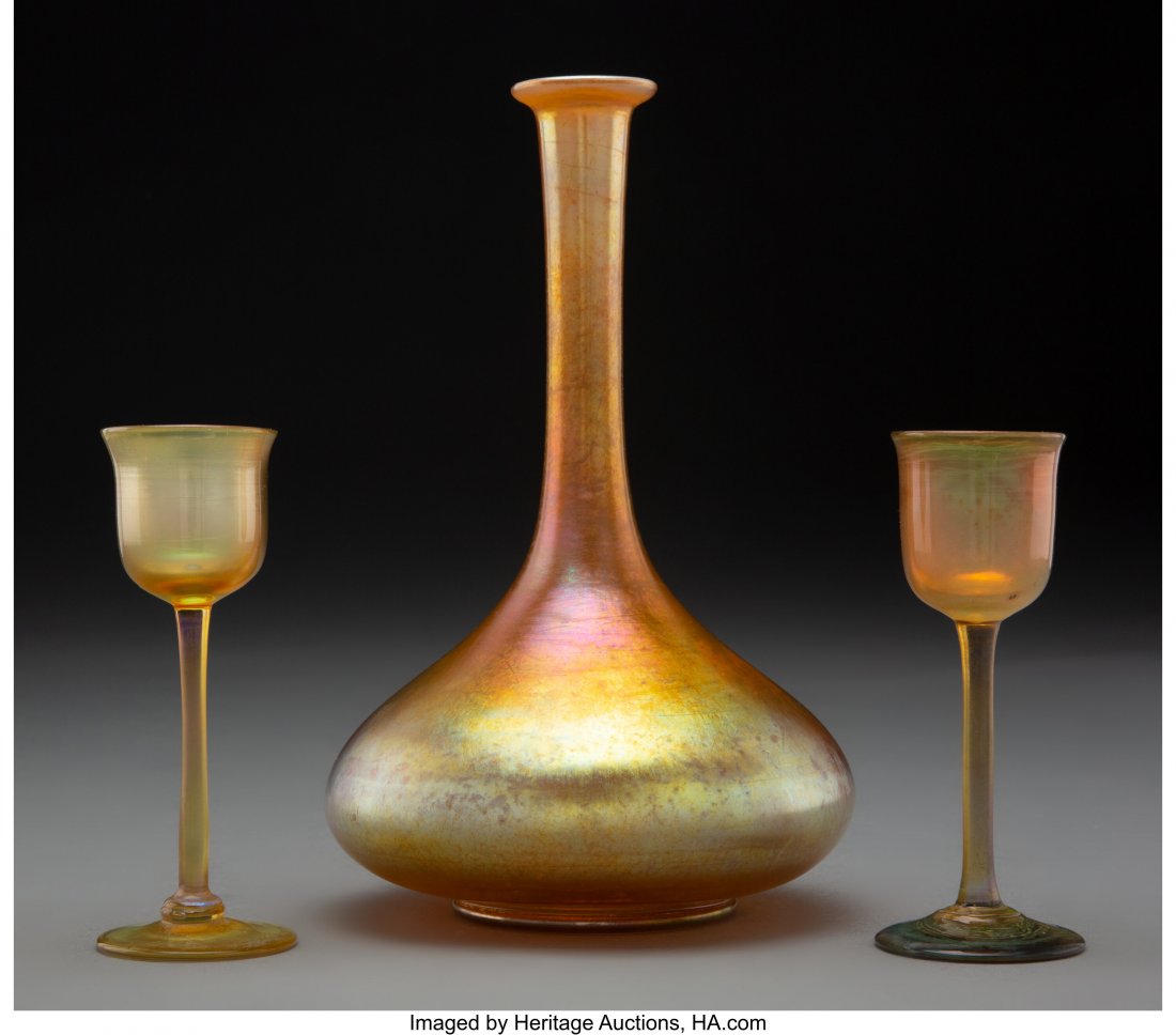 Tiffany Studios Favrile Glass Decanter with Two : Tiffany Studios Favrile Glass Decanter with Two Cordials, circa 1920 Marks to decanter: L.C. Tiffany-Favrile, 355 7-3/4 inches (19.7 cm) HID03101062020 © 2020 Heritage Auctions | All Rights Reser