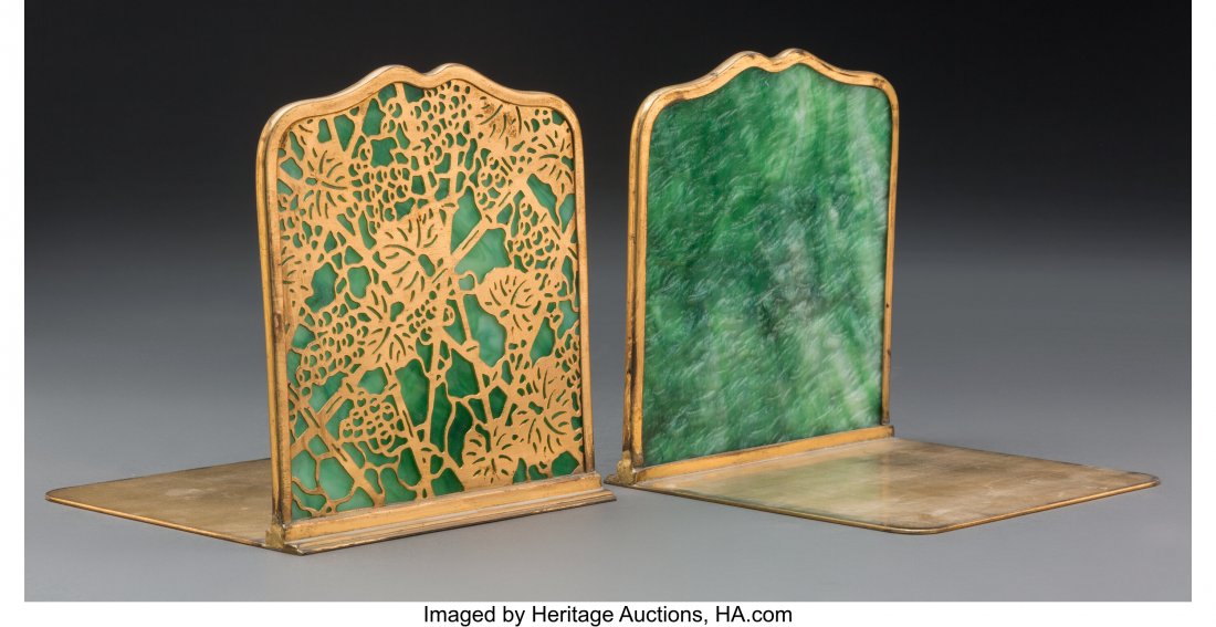Pair of Tiffany Studios Gilt Bronze and Glass Gr: Pair of Tiffany Studios Gilt Bronze and Glass Grapevine Bookends, circa 1900 Marks: TIFFANY STUDIOS, NEW YORK, 1024 6 inches (15.2 cm) (each) HID03101062020 © 2020 Heritage Auctions | All Rights 