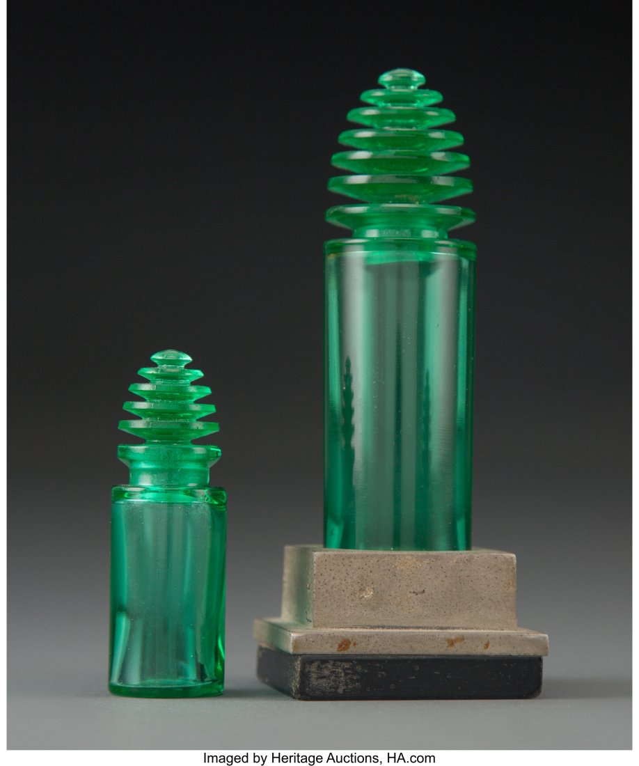Two R. Lalique Green Glass Sans Adieu Perfume Bo: Two R. Lalique Green Glass Sans Adieu Perfume Bottles for Worth with a Metal and Wood Base, circa 1929 Marks: R. LALIQUE, FRANCE 4-3/8 inches (11 cm) (tallest), M. p. 952, WORTH-11 PROPERTY FROM A PRI