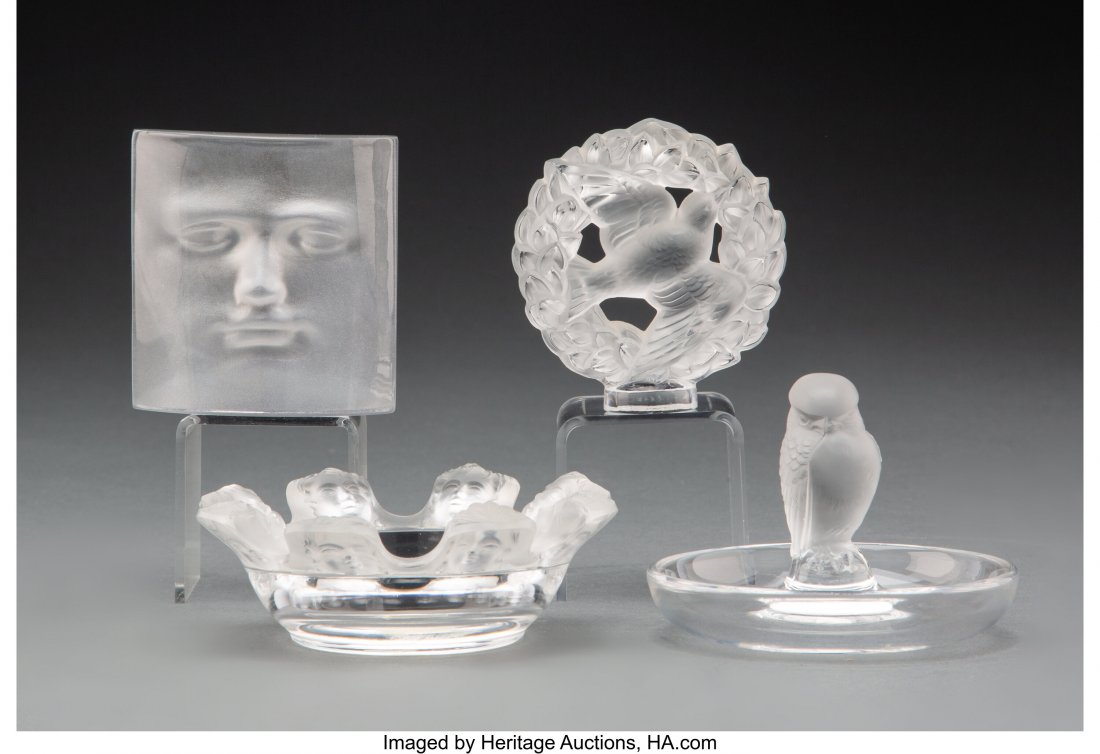 Three Lalique Clear and Frosted Glass Table Arti: Three Lalique Clear and Frosted Glass Table Articles and a Daum Glass Paperweight, post-1945 Marks to Lalique articles: Lalique®, France 3 inches (7.6 cm) (tallest, ring holder) The group comprisi