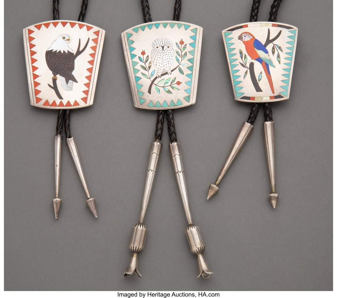 Three Zuni Bolo Ties Dennis and Nancy Edaakie c: Three Zuni Bolo Ties Dennis and Nancy Edaakie c. 1980 silver, turquoise, coral, jet, mother-of-pearl, abalone shell, lapis, each stamped Dennis / Nancy Edaakie Height of slides: ranging from 2 &fr