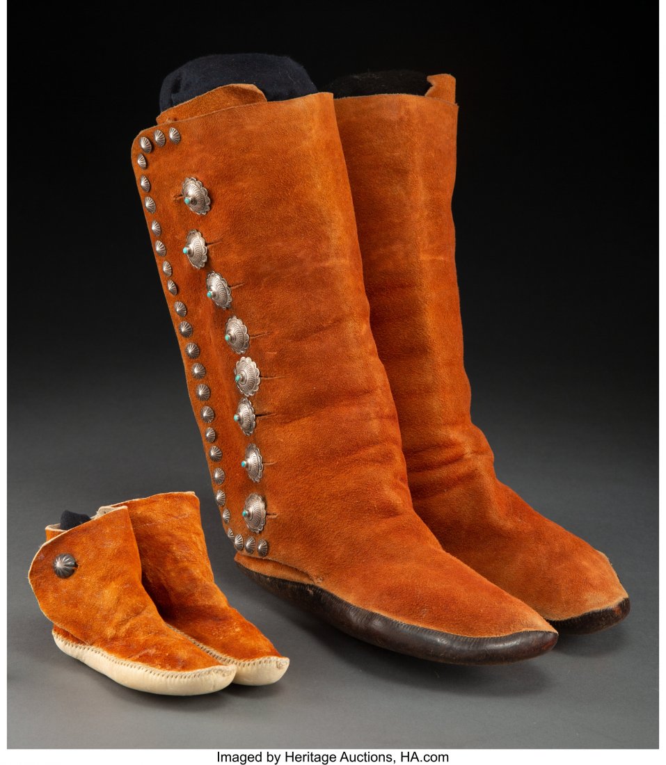 Two Pairs of Navajo Boot Moccasins c. 1950 hid: Two Pairs of Navajo Boot Moccasins c. 1950 hide, thread, silver, turquoise Provenance: From the L. D. Bax Collection Heights: 3 &frac14; and 12 inches HID03101062020 © 2020 Heritage Auctions 