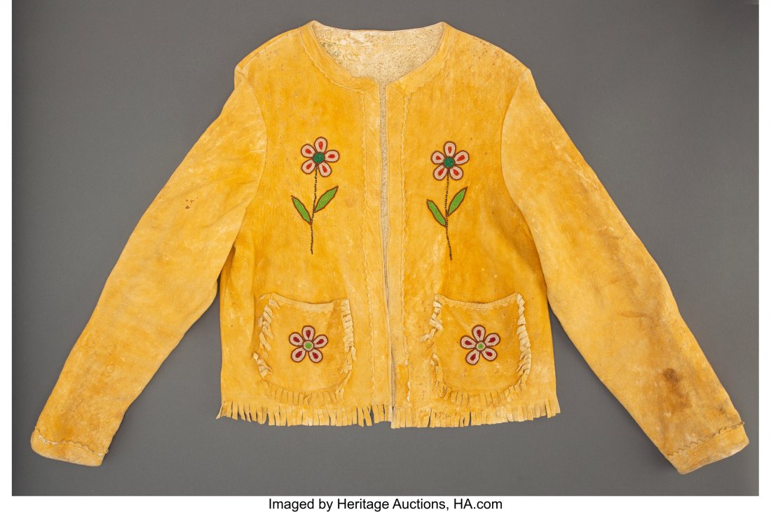 A Plateau Woman's Beaded Hide Jacket c. 1920 t: A Plateau Woman's Beaded Hide Jacket c. 1920 together with four pairs of Plains / Plateau gloves / gauntlets; hide, pigment, glass seed beads, thread Provenance: From the L. D. Bax Collection Length: 