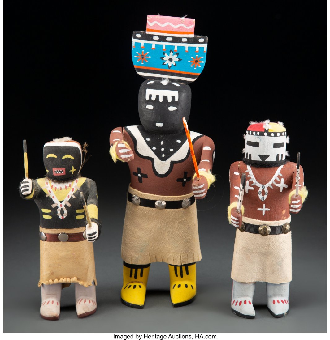 Three Hopi Kachina Dolls cottonwood, paint, hid: Three Hopi Kachina Dolls cottonwood, paint, hide, ribbon, metal tacks, wool yarn Heights: ranging from 6 &frac12; to 11 inches HID03101062020 © 2020 Heritage Auctions | All Rights Reserved