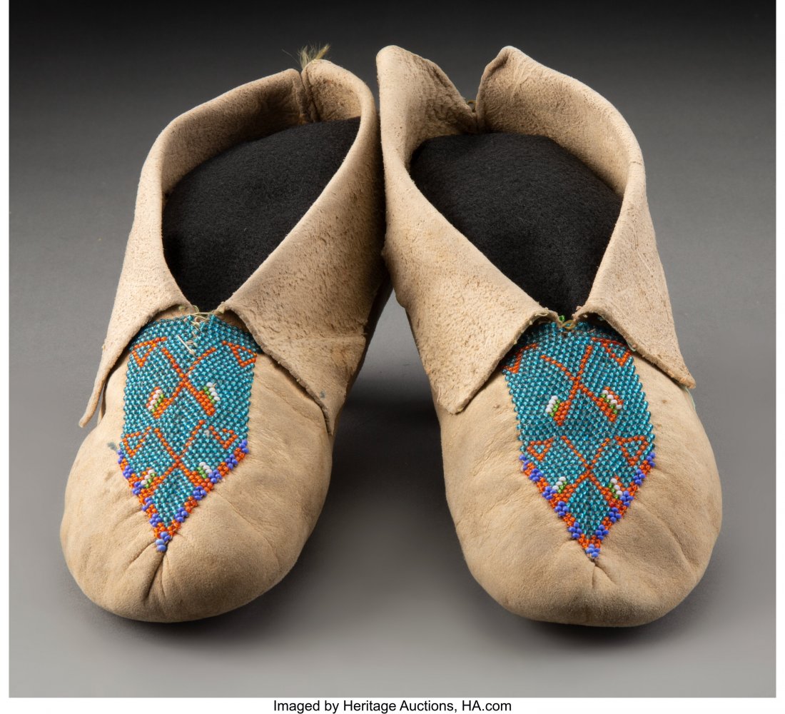 A Pair of Kickapoo Beaded Hide Moccasins Length: A Pair of Kickapoo Beaded Hide Moccasins Lengths: 9 &frac12; inches each HID03101062020 © 2020 Heritage Auctions | All Rights Reserved