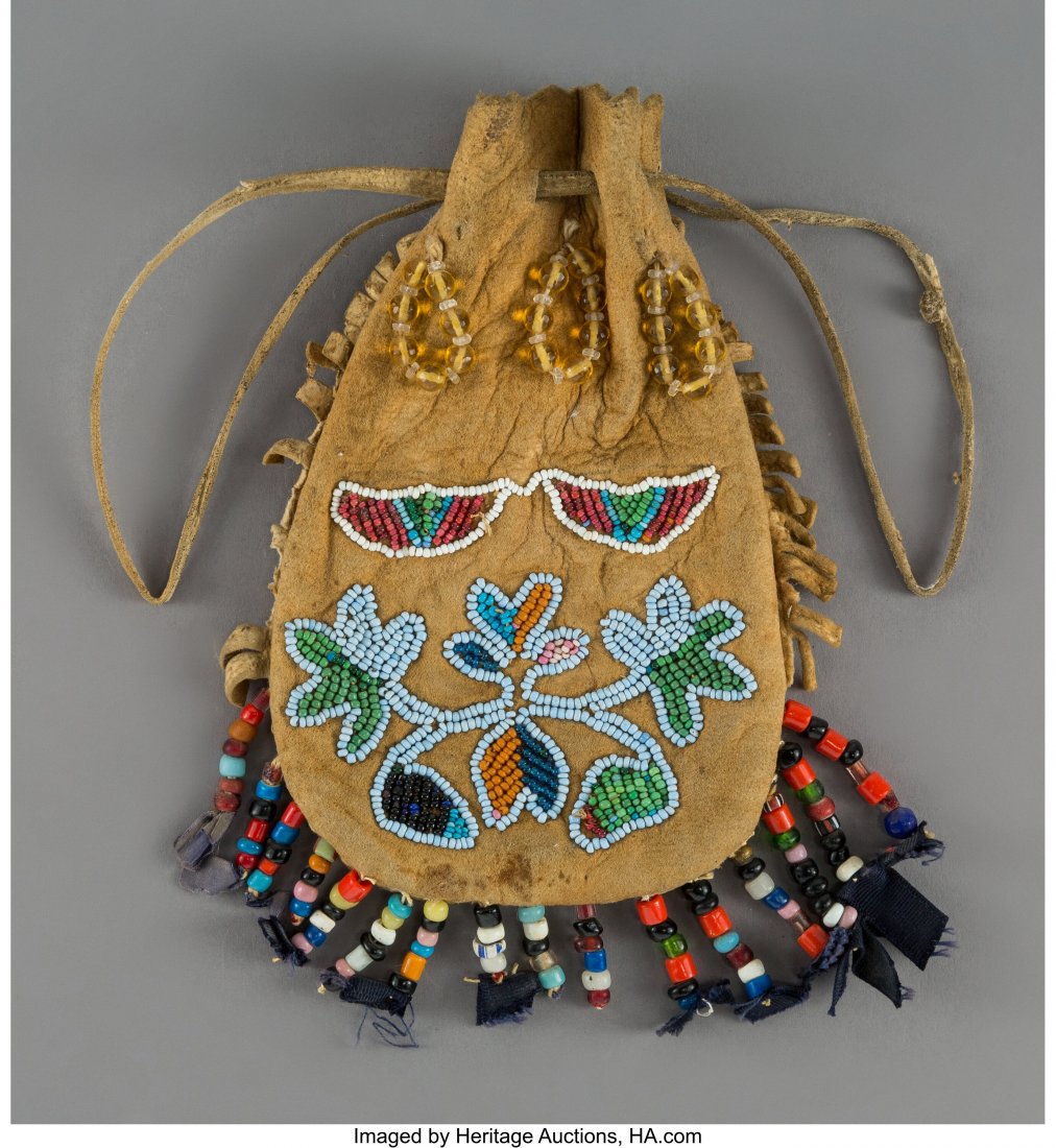 A Sioux Beaded Hide Drawstring Pouch Height: 7: A Sioux Beaded Hide Drawstring Pouch Height: 7 inches, excluding beaded fringe HID03101062020 © 2020 Heritage Auctions | All Rights Reserved