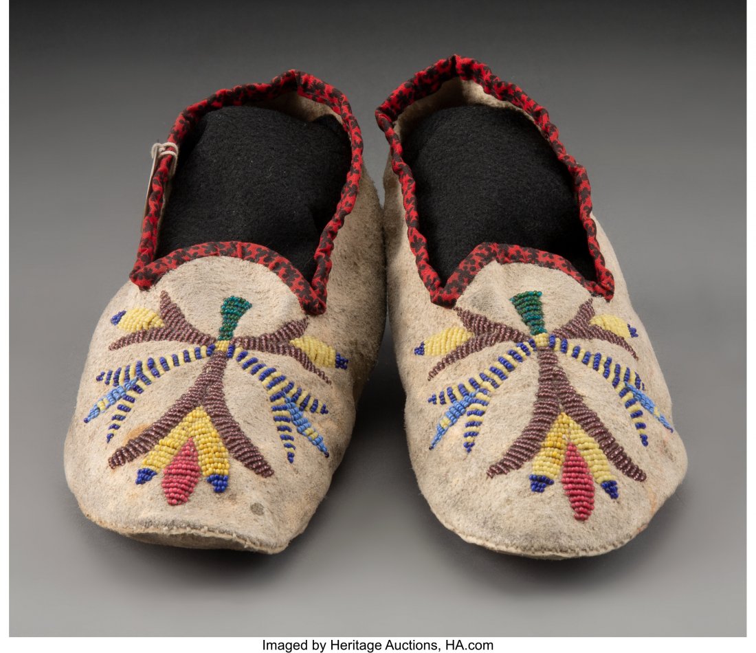 A Pair of Santee Sioux Beaded Hide Moccasins wi: A Pair of Santee Sioux Beaded Hide Moccasins with old circular tag attached, inscribed #112, Schondorf Coll., 3.75 Lengths: 9 &frac14; inches each HID03101062020 © 2020 Heritage Auctions | Al