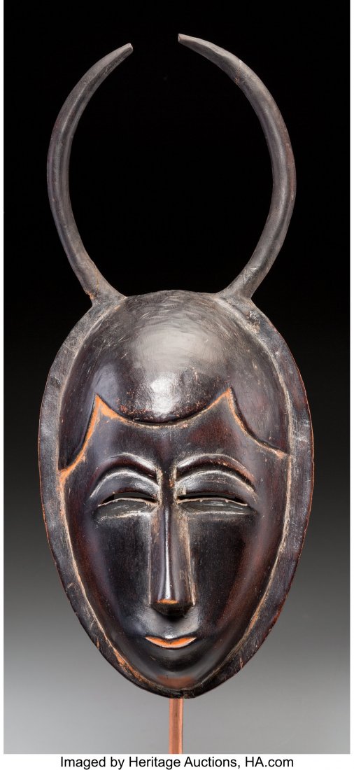 A Yaure Female Mask Ivory Coast Wonderful pati: A Yaure Female Mask Ivory Coast Wonderful patina on inside confirms this as an old example carved in an understated style, clearly distinct from later examples which tend to be over-embellished. Accen