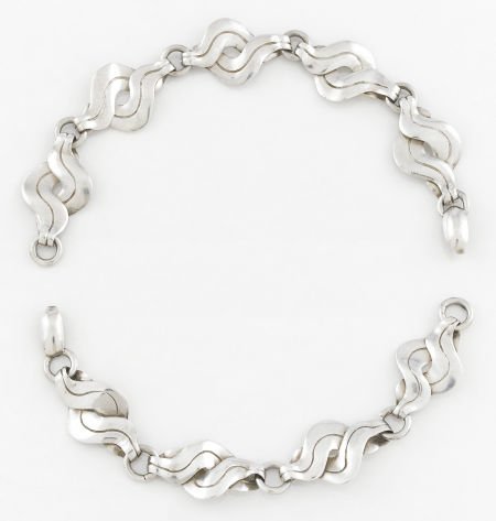 A PAIR OF MEXICAN SILVER BRACELETS William Sprat