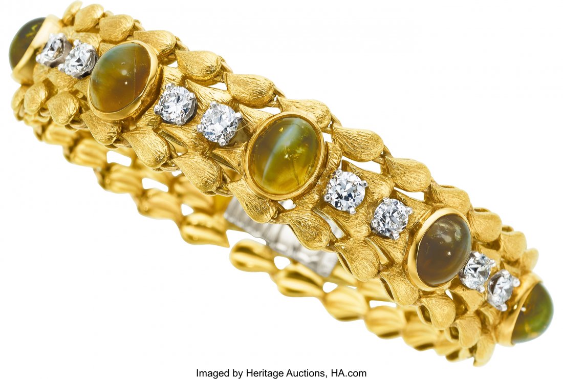 Cat's-Eye Chrysoberyl, Diamond, Platinum, Gold B: Cat's-Eye Chrysoberyl, Diamond, Platinum, Gold Bracelet, Julius Cohen The bracelet features oval-shaped cat's-eye chrysoberyl cabochons measuring 7.00 x 6.00 mm - 9.00 x 7.00 mm and weighing 21.26 car