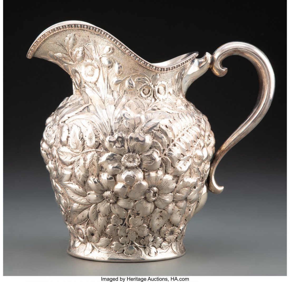 A Mauser Manufacturing Co. Repoussé Silve: A Mauser Manufacturing Co. Repoussé Silver Pitcher, New York, 1887-1903 Marks: (unicorn), STERLING , 2415, 4 PINT, 925/1000, FINE 8-1/4 x 6-3/4 x 9-1/4 inches (21.0 x 17.1 x 23.5 cm) 23.7 troy 
