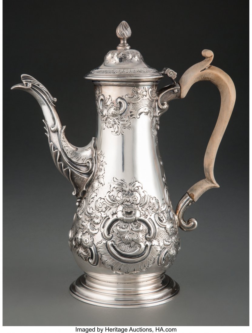 A Georgian Repoussé Silver Coffee Pot, Lo: A Georgian Repoussé Silver Coffee Pot, London, 1771 Marks: (lion passant), (crowned leopard's head), IA, Q 11 x 9 inches (27.9 x 22.9 cm) 31 ounces (gross) Property from the Estate of Kenneth Alan Hi