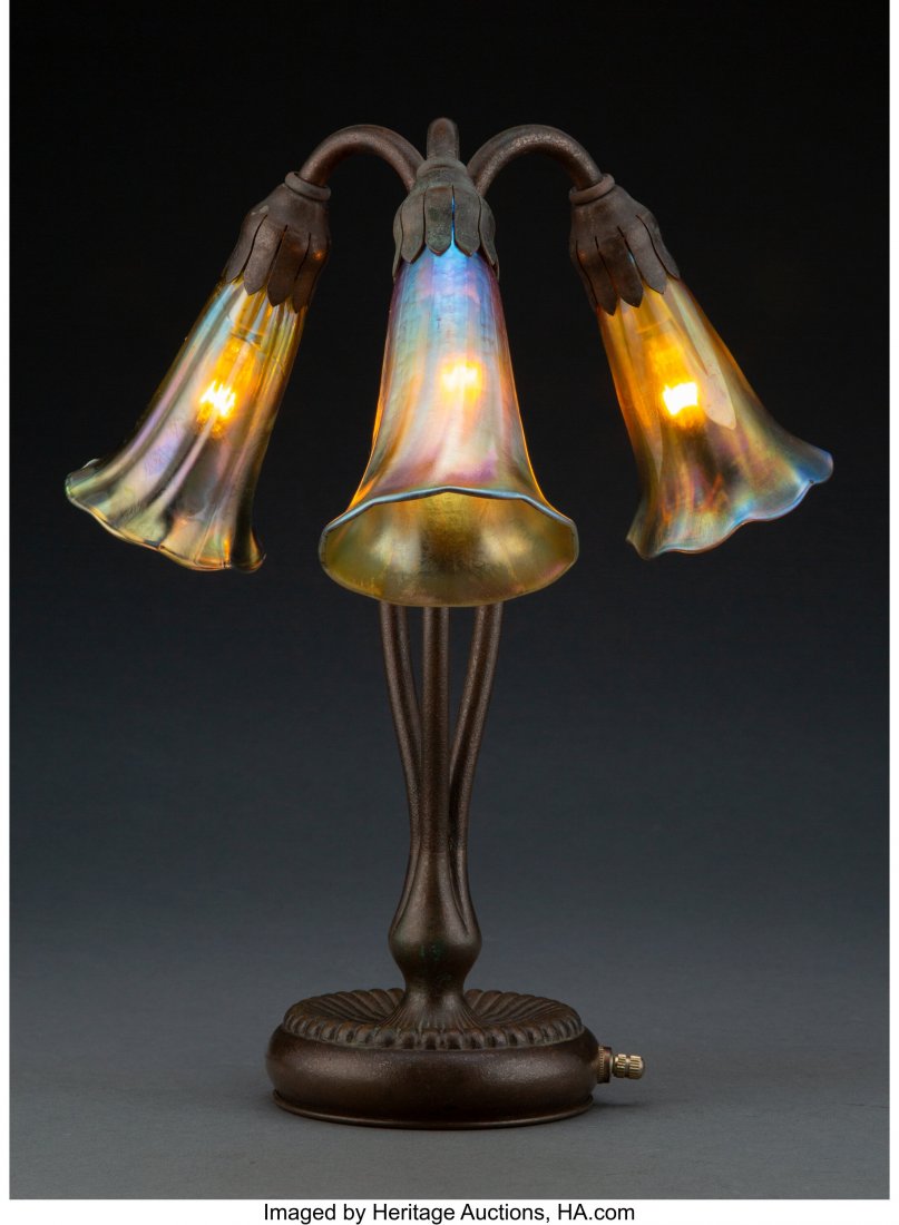 Tiffany Studios Three-Light Lamp Base with Three: Tiffany Studios Three-Light Lamp Base with Three Glass Shades, circa 1910 Marks to base: TIFFANY STUDIOS, NEW YORK, 319 Marks to one shade: L.C.T. Favrile 12-3/4 inches (32.4 cm) HID03101062020© 2020