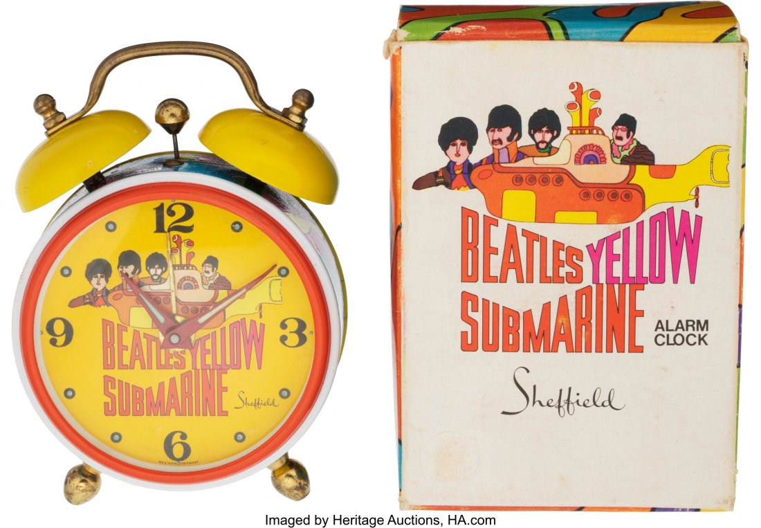 The Beatles Yellow Submarine Alarm Clock by Shef: The Beatles Yellow Submarine Alarm Clock by Sheffield With Box & Instructions (UK, 1968). You just do not see an example of this piece with the box and instructions anymore. 1) Measuring approx: 2
