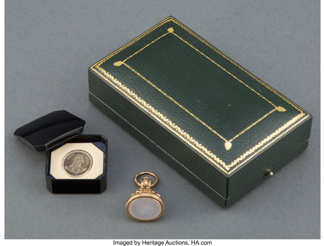An American Intaglio Seal with Portrait of Georg: An American Intaglio Seal with Portrait of George Washington and Mounted on a Gold Fob in Fitted Box, early 19th century Marks: GEORGE WASHINGTON 1 x 3/4 inches (2.5 x 1.9 cm) (seal) PROVENANCE: D.S. 