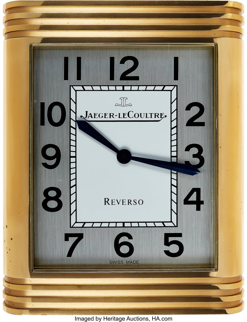 Jaeger-LeCoultre, Large Gilt Brass Dealers Wall: Jaeger-LeCoultre, Large Gilt Brass Dealers Wall Clock Case: 16 x 13 inches, solid brass, gilt finish, rounded sides, banded top and bottom lines Dial: two tone silver, black Arabic numerals, inner min