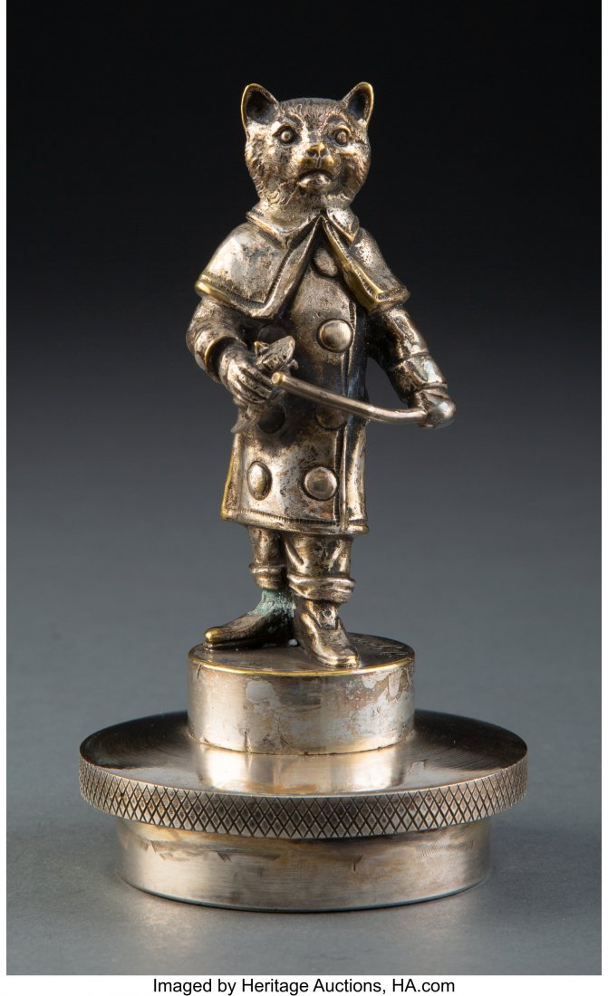 Jean Garnier Puss in Boots Nickel Silvered Autom: Jean Garnier Puss in Boots Nickel Silvered Automobile Mascot, circa 1920 Marks: J. Garnier 4-1/2 inches (11.4 cm) (excluding cap) HID03101062020 © 2020 Heritage Auctions | All Rights Reserved