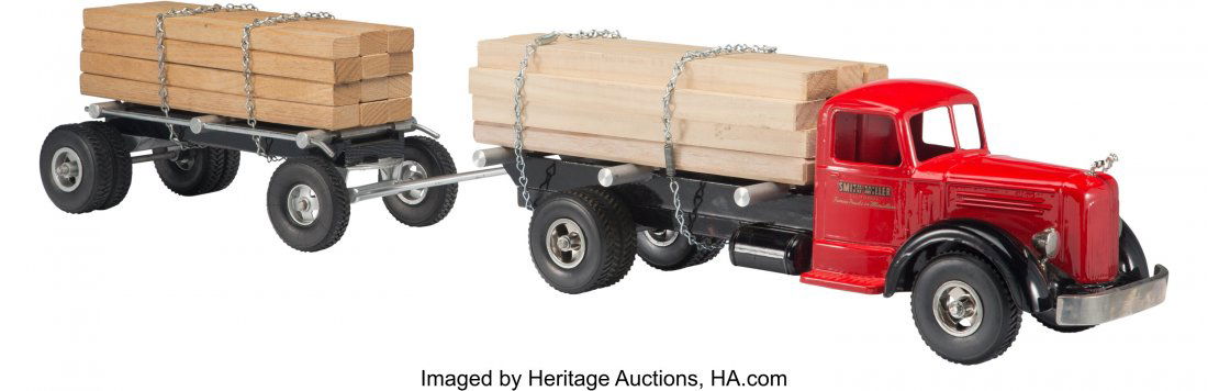 Smith-Miller Mack Lumber and Material Hauling Tr: Smith-Miller Mack Lumber and Material Hauling Truck and Pup Trailer, circa 1950 Marks: SMITTY TOYS, SMITH MILLER, B 2012 36-1/4 x 5-3/4 x 6-1/2 inches (92.1 x 14.6 x 16.5 cm) The Mack truck with tande