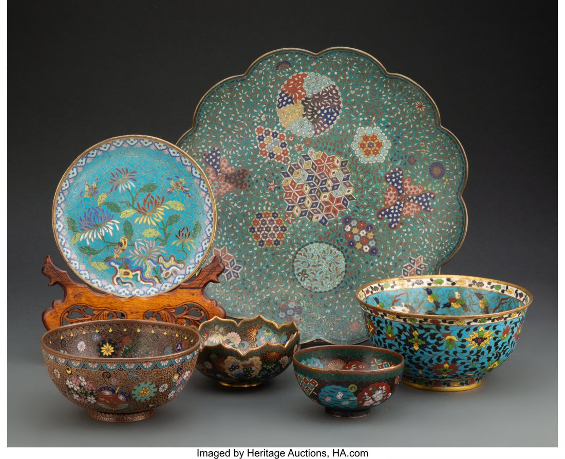 A Group of Six Japanese Cloisonné Vessels 13 x: A Group of Six Japanese Cloisonné Vessels 13 x 13 x 2 inches (33.0 x 33.0 x 5.1 cm) (largest, platter) The group comprising four rice bowls, a scalloped platter and a small plate on a carved wo