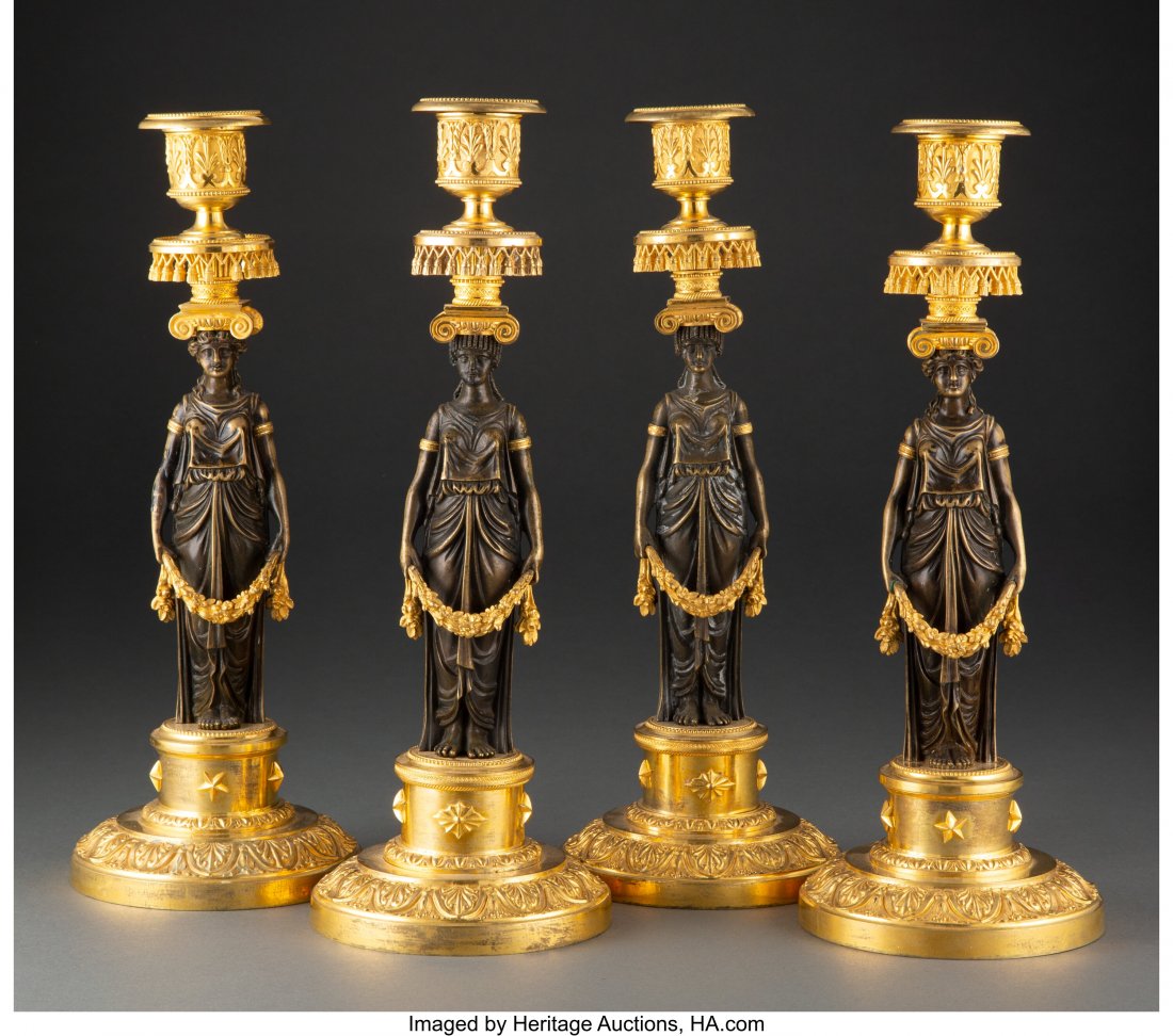 A Set of Four French Directoire Patinated and Gi: A Set of Four French Directoire Patinated and Gilt Bronze Candlesticks, circa 1795 13-1/4 x 4-3/4 x 4-3/4 inches (33.7 x 12.1 x 12.1 cm) Property from the Collection of John Robert Clark HID0310106202