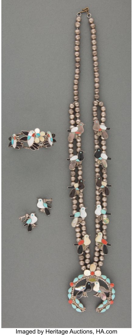 A Zuni Jewelry Suite Wesley and Ella L. Gia c. : A Zuni Jewelry Suite Wesley and Ella L. Gia c. 1977 including a bracelet, pair of screw back earrings and a squash blossom necklace, engraved, Wesley and Ella L. Gia, "77" Zuni, New Mexico, silver, tu