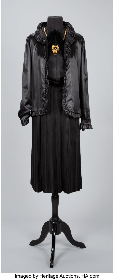 A Coco Chanel Black Dress and Coco Chanel Jacket: A Coco Chanel Black Dress and Coco Chanel Jacket with Necklace Labels to dress and jacket: CHANEL Size: 4-6 IMPORTANT NOTE: All of the clothing, shoes, handbags, hats, and jewelry lots in this auction