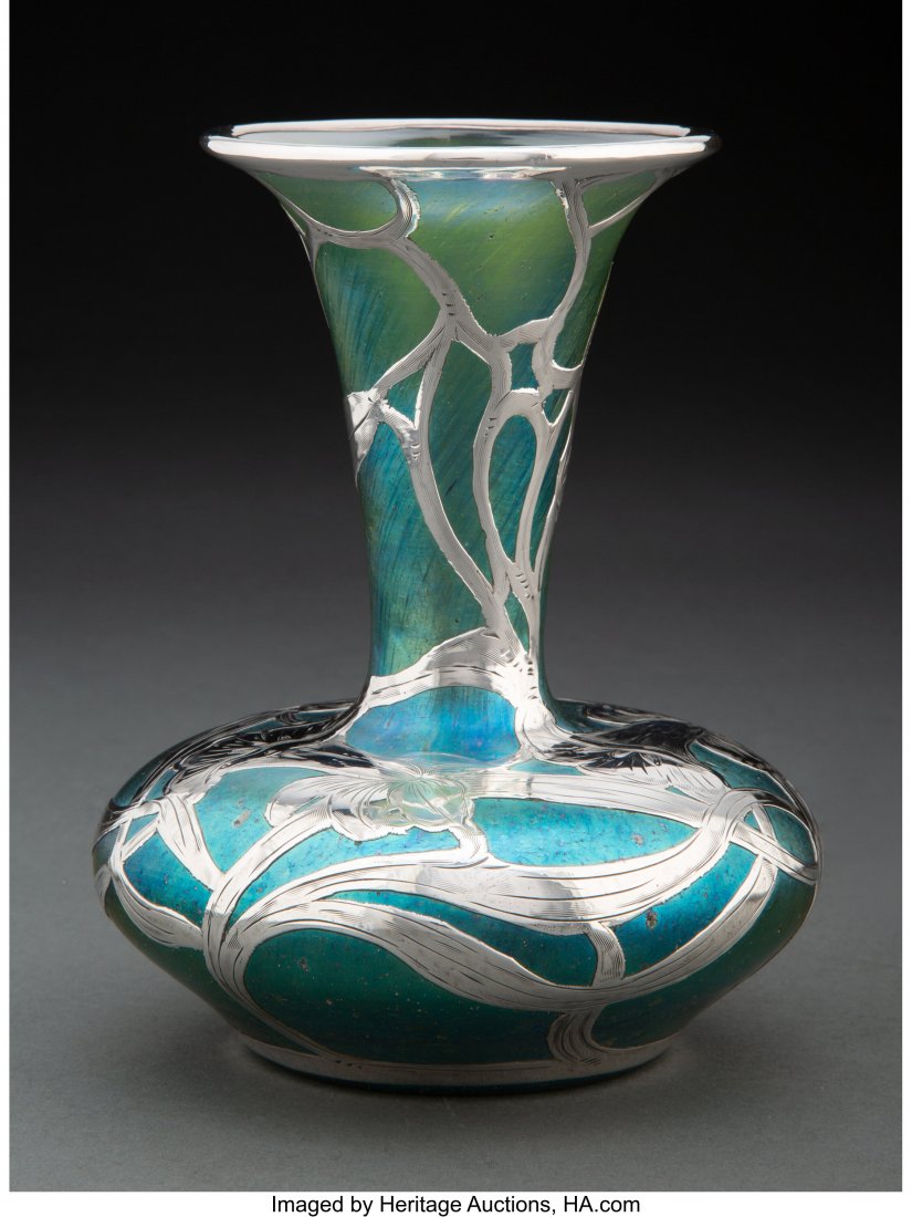 A Loetz Glass Vase with La Pierre SIlver Overlay: A Loetz Glass Vase with La Pierre SIlver Overlay, circa 1900 Marks: L, STERLING 6-1/8 x 4-7/8 x 4-7/8 inches (15.6 x 12.4 x 12.4 cm) HID03101062020 © 2020 Heritage Auctions | All Rights Reserved