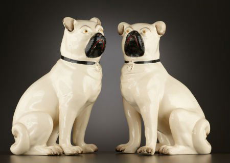 A PAIR OF VICTORIAN EARTHENWARE PUG DOGS Staffo: A PAIR OF VICTORIAN EARTHENWARE PUG DOGS Staffordshire, England, circa 1880Unmark