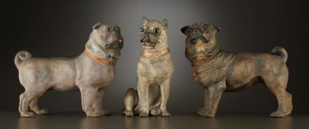 THREE VICTORIAN EARTHENWARE PUG DOGS British or: THREE VICTORIAN EARTHENWARE PUG DOGS British or German, circa 1870-1880Unmarked