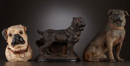 TWO EARTHENWARE GLASS-EYED PUG DOGS AND A CHALKW: TWO EARTHENWARE GLASS-EYED PUG DOGS AND A CHALKWARE PUG Probably German, circa 1870-1
