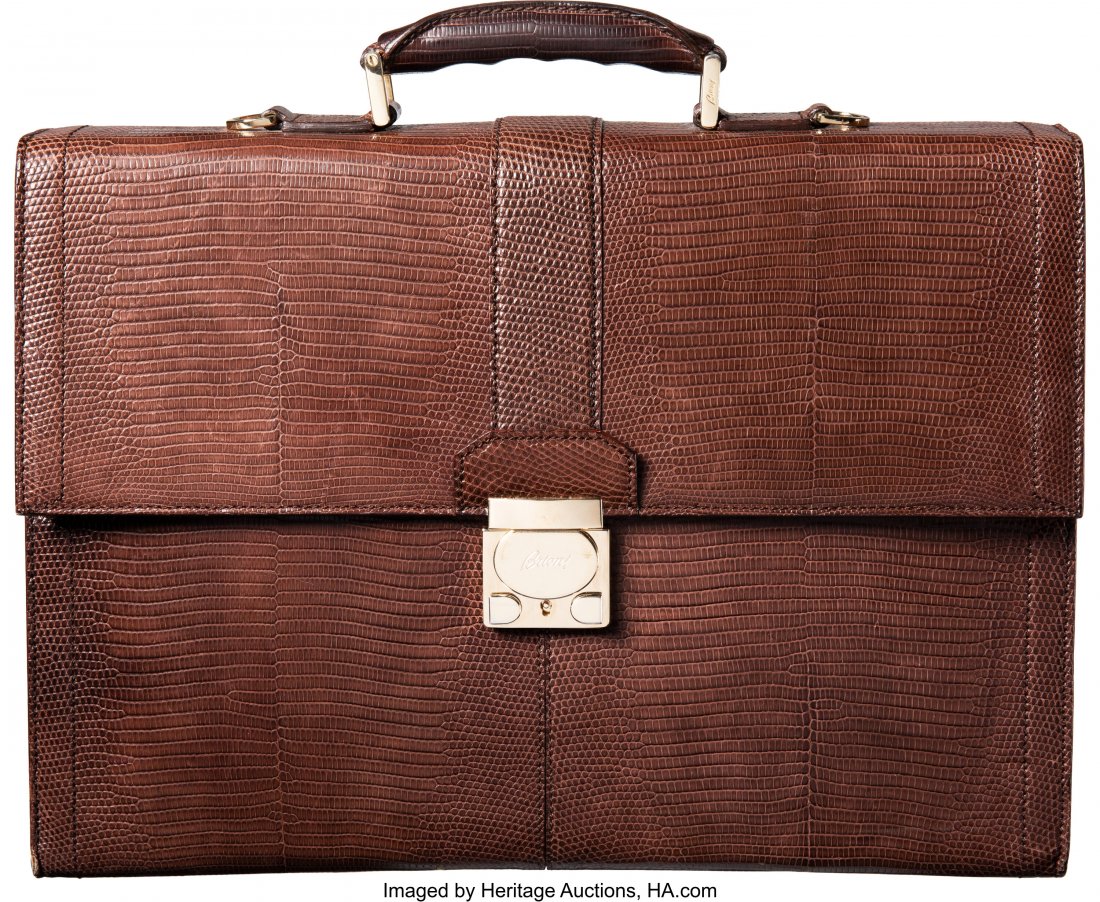 Brioni Brown Lizard Briefcase Condition: 4 16.5": Brioni Brown Lizard Briefcase Condition: 4 16.5" Width x 12" Height x 4.5" Depth This briefcase is done in brown lizard with gold hardware, featuring a rear slide pocket, one top handle, and a flap to