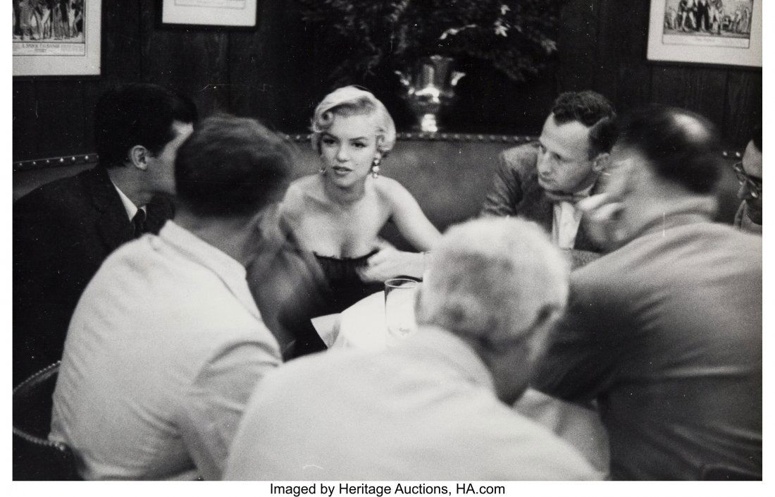 Sam Shaw (American, 1912-1999) Marilyn Monroe, S: Sam Shaw (American, 1912-1999) Marilyn Monroe, Seated with George C. Scott, circa 1954 Gelatin silver print, ferrotyped 7-3/4 x 12 inches (19.7 x 30.5 cm) (image/sheet) Photographer's stamp and V.I.P.
