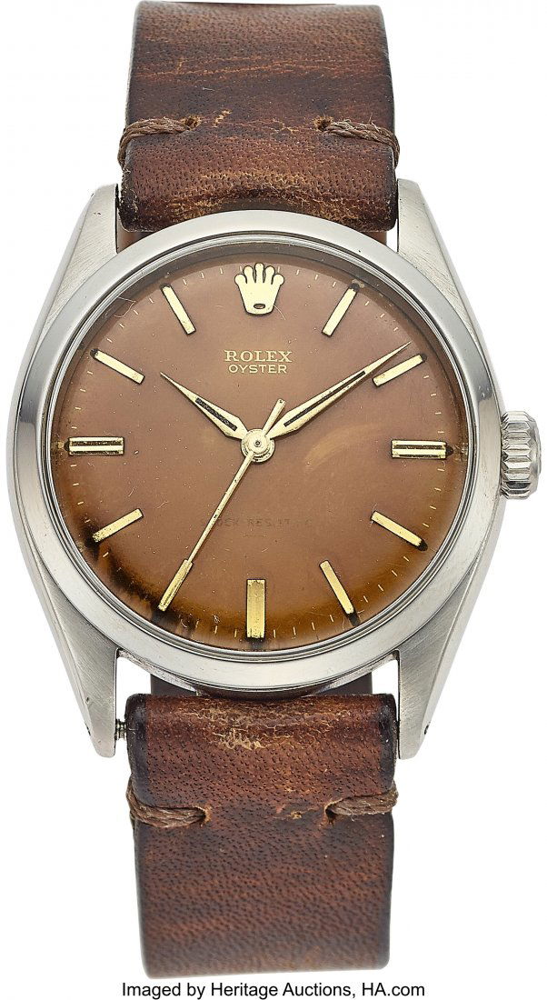 Rolex Rare Stainless Steel Oyster Wristwatch Ref: Rolex Rare Stainless Steel Oyster Wristwatch Ref: 6480 with Tropical Underlined Dial and "Bart Simpson" applied logo, circa 1962 Case: 34mm, stainless steel, three piece