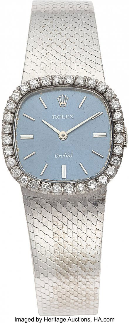 Rolex, Very Fine Ladies Orchid, 18K White Gold a: Rolex, Very Fine Ladies Orchid, 18K White Gold and Diamond, Ref. 2673, Circa 1975 Case: 23mm x 23mm, 18k white , 23mm, 18K white gold, snap