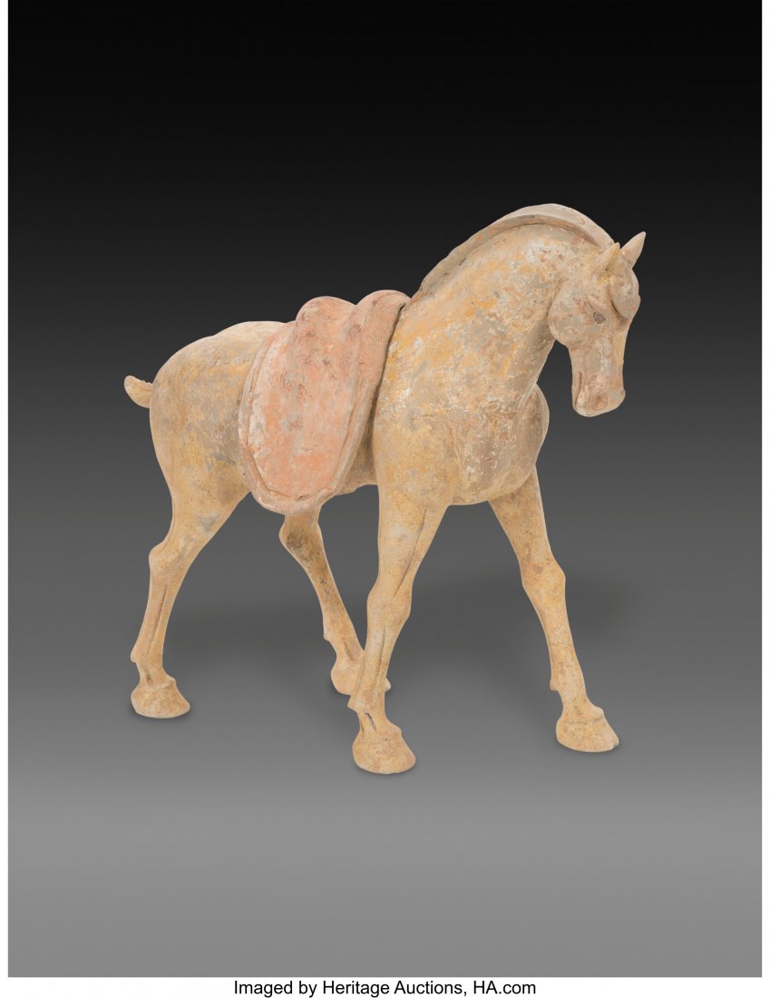 A Chinese Pottery Horse with Saddle 14 x 8 x 17 : A Chinese Pottery Horse with Saddle 14 x 8 x 17 inches (35.6 x 20.3 x 43.2 cm) HID03101062020 © 2020 Heritage Auctions | 