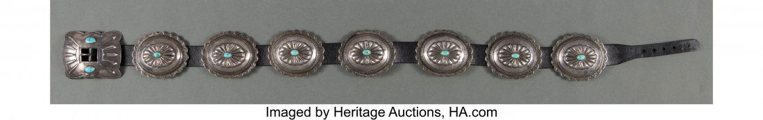 A Navajo Concho Belt c. 1960 silver, turquoise: A Navajo Concho Belt c. 1960 silver, turquoise, commercial leather, copper Provenance: Film and television actor and director James Darren, Los Angeles, CA L